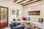 Living room bursting with Southwestern charm, centering the TV